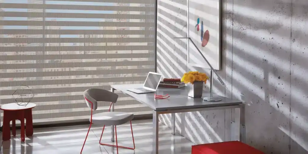 Bright, minimalistic office with natural light, contemporary furniture, laptop and vibrant accents.