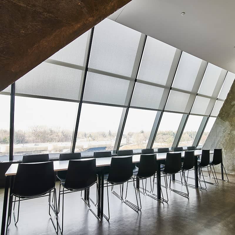 Elegant commercial blinds designed for large windows in modern office environments. Enhance privacy, control light, and improve energy efficiency with stylish window coverings.