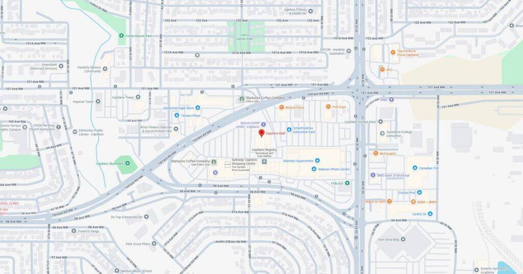 A map view showing a city with highways, streets, and a central location marked with a red pin.